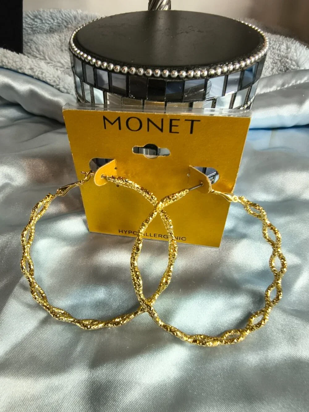 Monet Gold Tone Criss Cross Hoop earrings